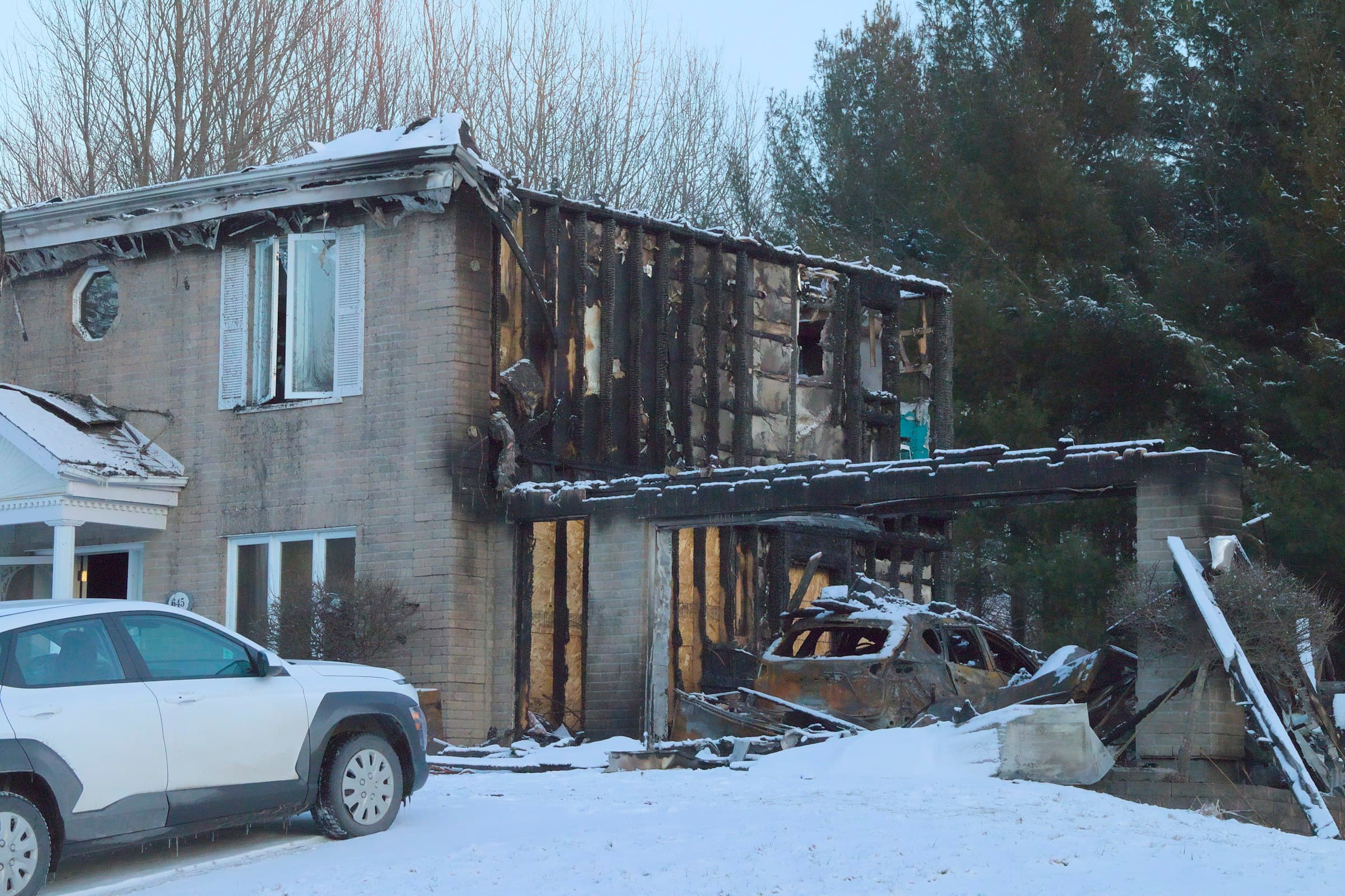 Fire-damaged home in the snow awaiting restoration in the Mat-Su Valley